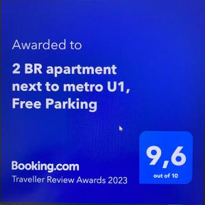a blue text box with the words upgraded to appointment next to metrouto at 2 BR apartment next to metro U1 and P&R garage in Vienna