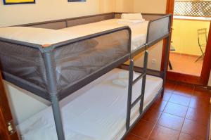 a black bunk bed in a room at Casa con piscina en el Casco Historico in Tossa de Mar