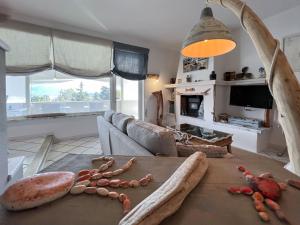 a living room with a couch and a table at A casa di Enrico B&B in Portoferraio