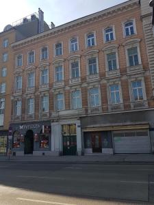 a large brick building on the corner of a street at Gerald´s Apartment 19 in Vienna