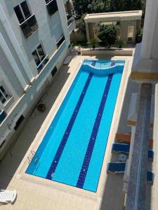 an overhead view of a swimming pool in a building at Antalya liman Apartment 1+1 in Antalya