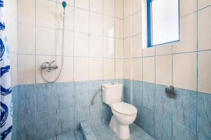 A bathroom at Kiotari beach garden view-sea view