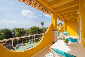 a balcony with a view of a pool at Apartment Sandra by the sea in El Campello