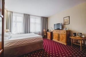 Rúm í herbergi á Hotel Solaris