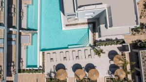 an aerial view of a hotel with a swimming pool at Sun City Luxury Apartments in Asgourou