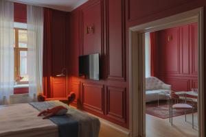 Postel nebo postele na pokoji v ubytování Leopolis Hotel