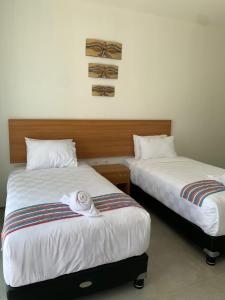 Postel nebo postele na pokoji v ubytování Kahurangi Hotel + 24 fotografií