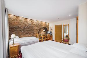 Rúm í herbergi á Hotel Solaris