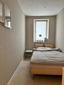 Een bed of bedden in een kamer bij Palais Alsace