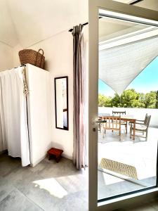a room with a door open to a patio at Dimora delle Tonnare in Favignana