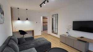 En TV eller et underholdningssystem på Apartments Spring