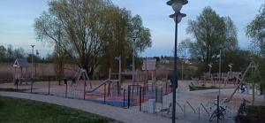 a playground in a park with a play area at u Tymka in Iława