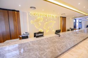 a lobby with a goldenbeck sign on the wall at Golden Beach Resort in Hurghada +166 photos