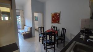 a kitchen with a table and chairs in a room at 10 apartmants Olimpia MIR in Durrës