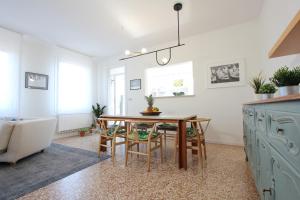 a kitchen with a table and chairs in a room at City Apartments Salute-Accademia in Venice