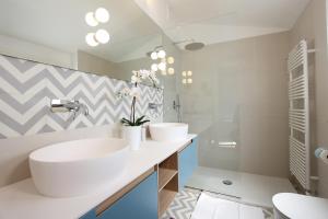 a bathroom with a white sink and a mirror at City Apartments Salute-Accademia in Venice