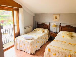 Postel nebo postele na pokoji v ubytování HOSTAL JJ salduero