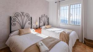 Łóżko lub łóżka w pokoju w obiekcie Casa Los Almendrales Torrox by Ruralidays