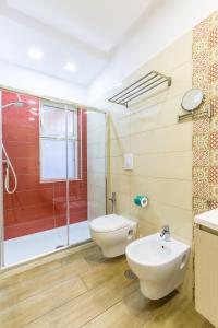 a bathroom with a toilet and a sink at Il Riccio di Sole a meno di 5 minuti da Sorrento in Sant'Agnello +41 photos