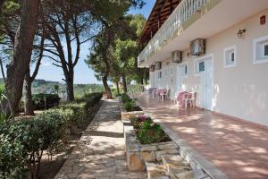 a walkway leading to the side of a building at Zante View Apartment in Planos