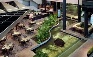 an overhead view of a restaurant with tables and chairs at Hyatt Regency Houston West in Houston