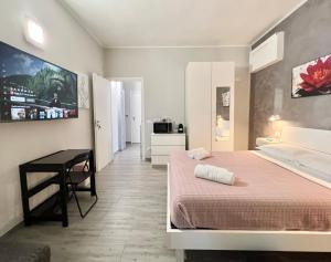 a bedroom with a bed and a desk in it at B&B girasole in Verona