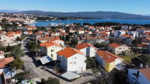 an aerial view of a town with orange roofs at Apartment Morozin in Krk