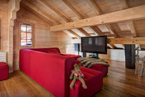 Μια τηλεόραση ή/και κέντρο ψυχαγωγίας στο Chalet Flocon Magique - OVO Network +20 φωτογραφίες