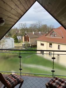 a view from the window of a house at Ferienwohnung Teichblick -Balkon- in Dresden