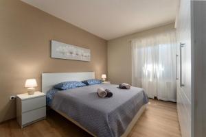 Postel nebo postele na pokoji v ubytování Apartments Nevenka
