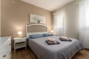 Postel nebo postele na pokoji v ubytování Apartments Nevenka