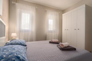 Postel nebo postele na pokoji v ubytování Apartments Nevenka