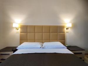 Postel nebo postele na pokoji v ubytování Hotel Delle Ortensie
