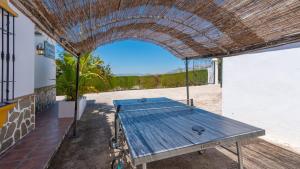 a picnic table in the courtyard of a building at Casa Paraiso Tropical Torrox by Ruralidays in Torrox