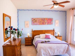a bedroom with a bed and a ceiling fan at Holiday Home Mestral by Interhome in Alcanar