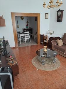 a living room with a couch and a table at Casa de La Parra in Valverde de Júcar