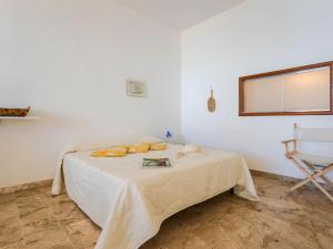 A bed or beds in a room at Studio Seccagrande by Interhome