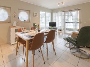 a kitchen and living room with a table and chairs at Apartment Estepona with parking by Interhome in Mispelburg