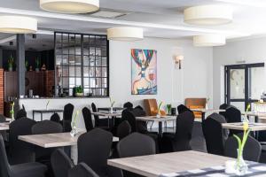 Reštaurácia alebo iné gastronomické zariadenie v ubytovaní Marena Wellness & Spa