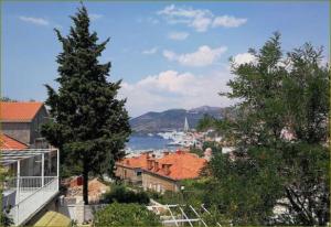 a view of a city with a river and trees at Apartments Dub in Dubrovnik