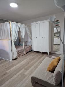 a bedroom with a bed and a dresser in a room at Casa Cirilla in Lerici