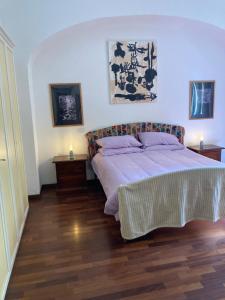a bedroom with a large bed with two night stands at Lovely Apartment in Testaccio, Rome in Rome