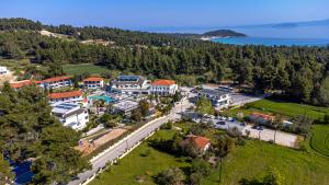 an aerial view of a resort with a lake at Chrousso Village in Paliouri