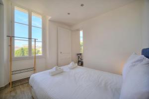 Posteľ alebo postele v izbe v ubytovaní IMMOGROOM-Suquet-AC-WIFI-close to the beaches