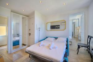 Posteľ alebo postele v izbe v ubytovaní IMMOGROOM-Suquet-AC-WIFI-close to the beaches