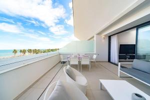 a living room with a view of the ocean at Luxury Duplex Penthouse Denia in Denia