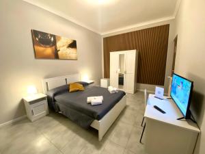 TV a/nebo společenská místnost v ubytování Golden Milano Hotel