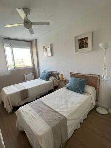 Giường trong phòng chung tại Costa Ballena - Duplex Playa Lar Beach House