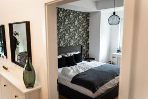 Katil atau katil-katil dalam bilik di Moderne Wohnung im Herzen Offenbachs