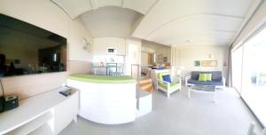 een woonkamer met een bank en een tafel bij Apartamentos Casas Carmen - Adults Only in Playa del Inglés